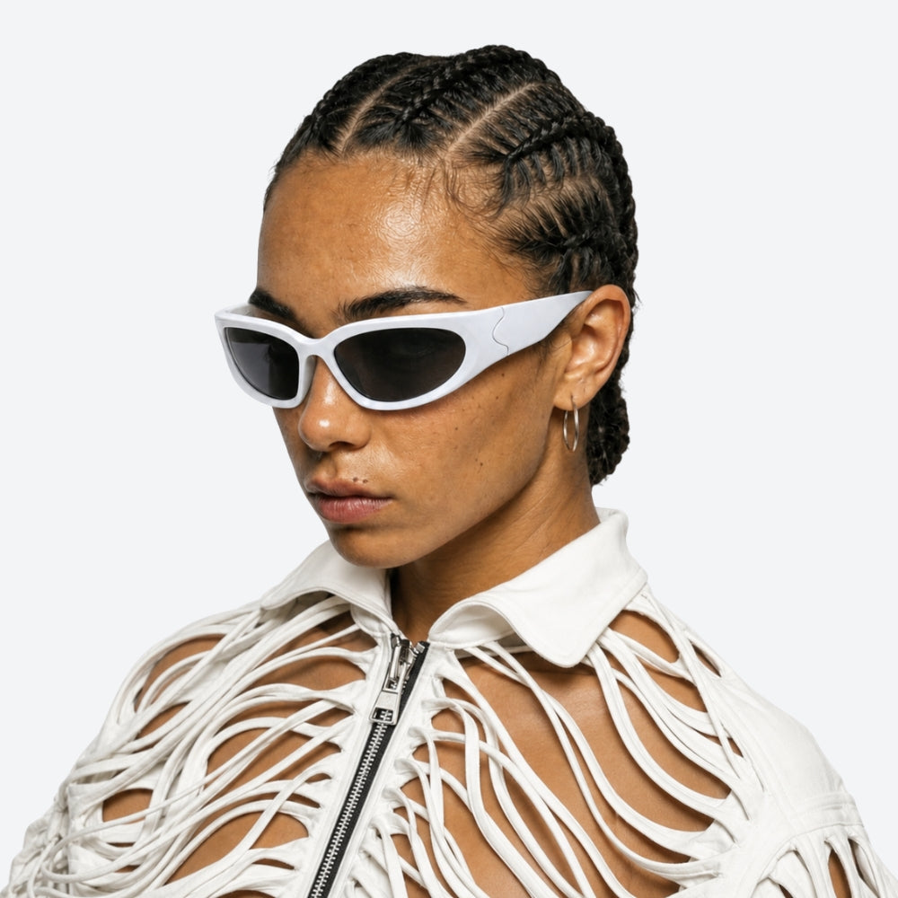 Person wearing white VYSER White sunglasses with dark lenses on a white background
