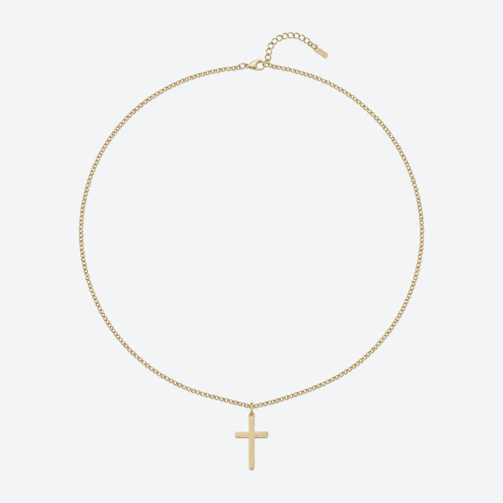 A delicate gold chain necklace with a small, minimalist cross pendant, displayed against a clean, light gray background.