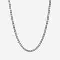 A silver-toned tennis chain necklace paved with small clear stones, shown against a plain light gray background.