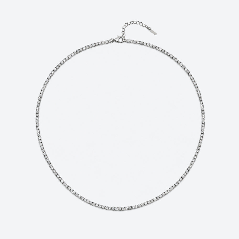 A silver-toned chain necklace with a small oval link design and an adjustable extender chain with a tag, displayed on a light gray background.