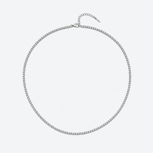 A silver-toned chain necklace with a small oval link design and an adjustable extender chain with a tag, displayed on a light gray background.