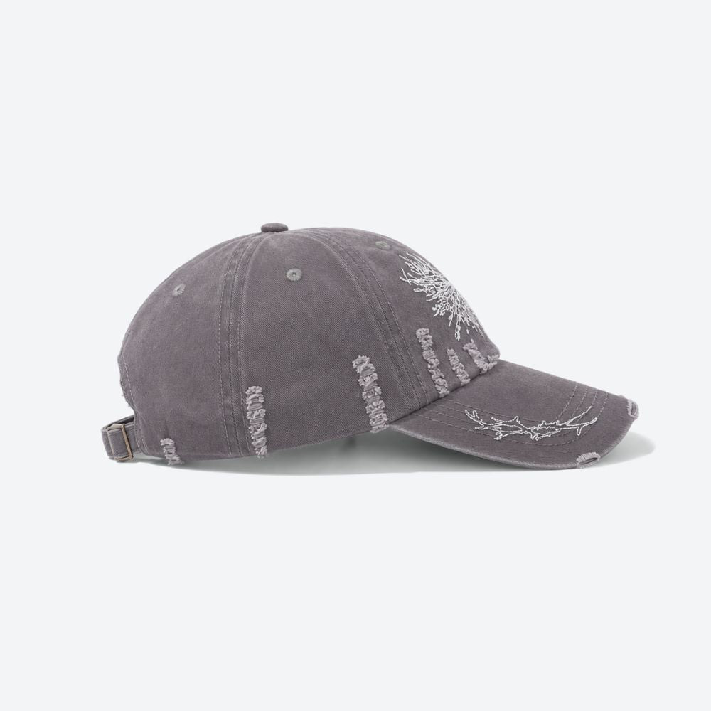 Side profile of a grey distressed baseball cap showing the embroidered thorn branch running along the brim