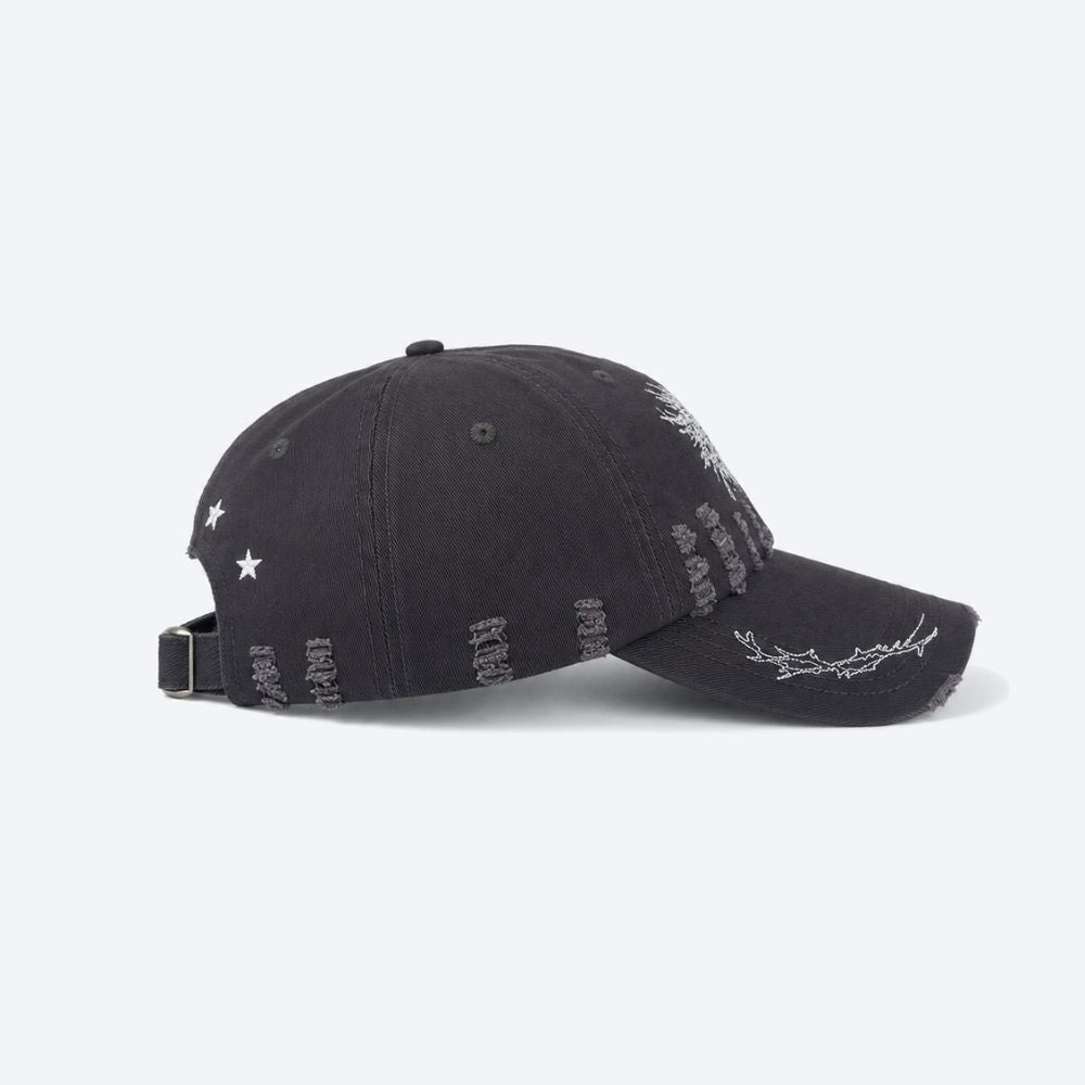 Side profile of a black distressed baseball cap showing the embroidered thorn branch running along the brim