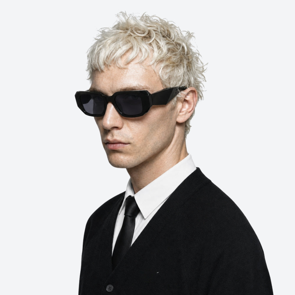 Person wearing VYSER Black sunglasses with a white background