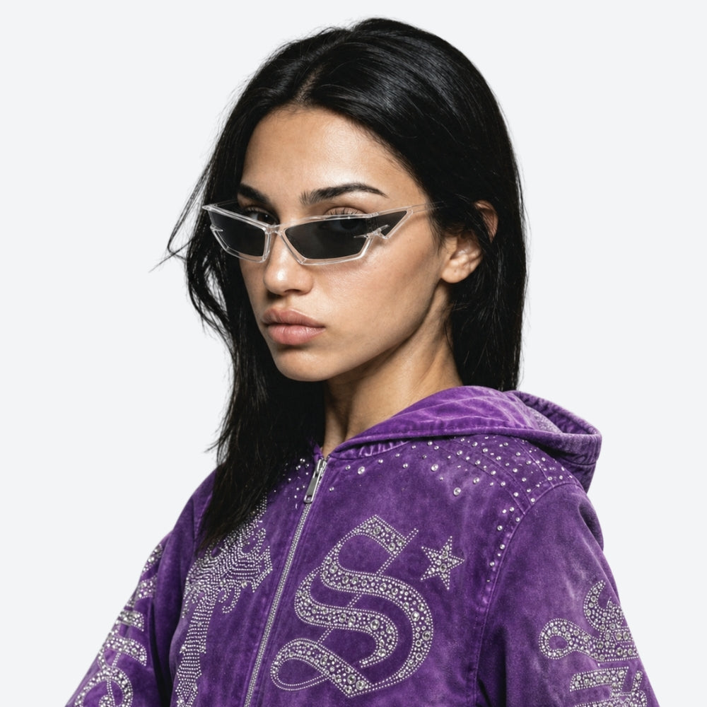 Person wearing a purple hoodie with VYSER Clear sunglasses with dark lenses on a light gray background