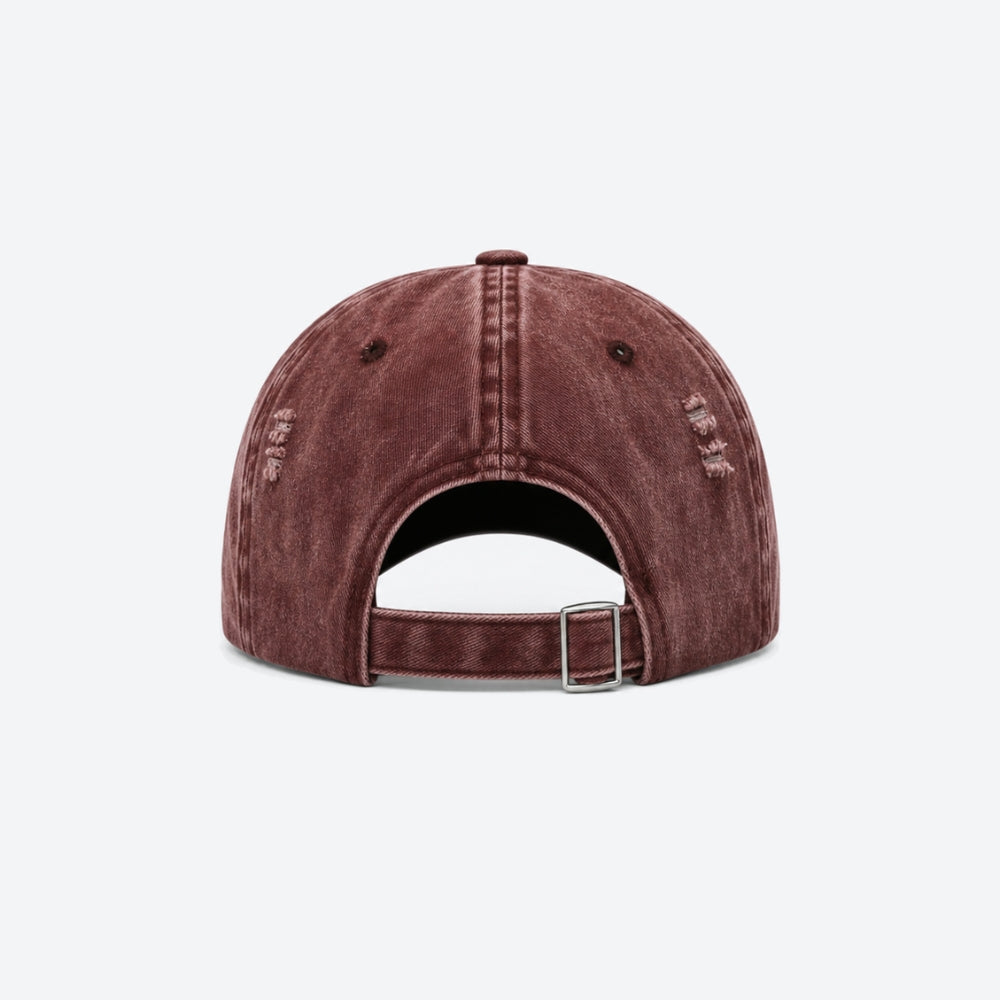 Back view of a washed burgundy baseball cap with an adjustable buckle strap