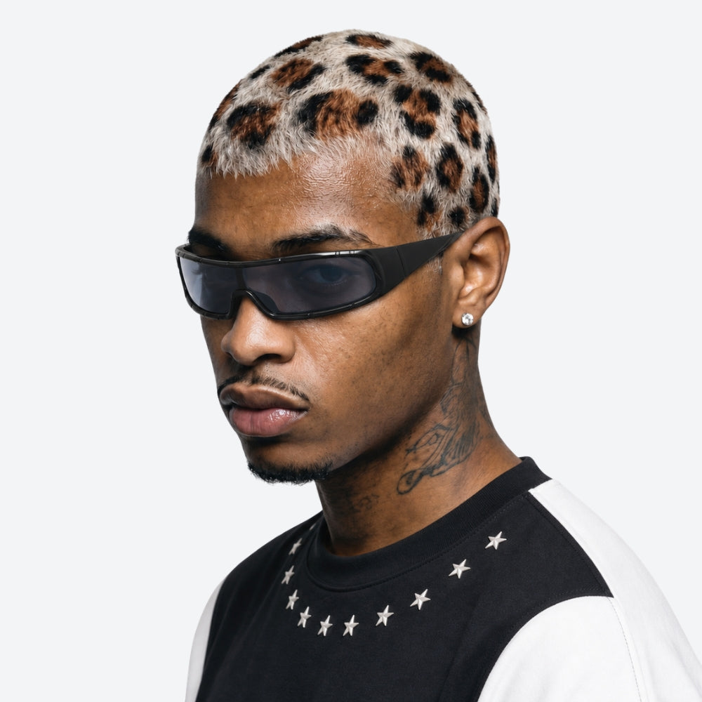 Man wearing VYSER Black sunglasses with dark lenses on a white background