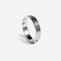 A polished silver band ring with a textured, wavy channel pattern on the outer surface, shown on a clean light gray background.