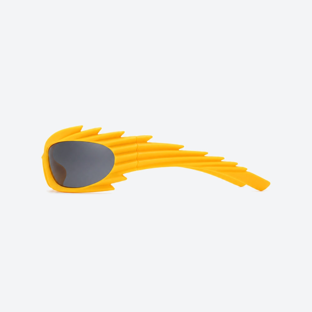 VYSER Yellow sunglasses with a unique frame design on a white background
