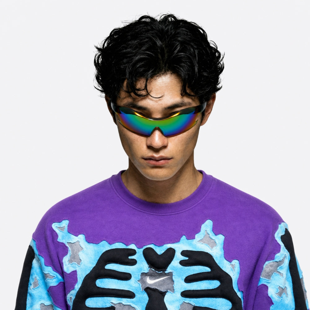 Person wearing a purple sweater with VYSER Sunglasses with colorful lens and black frame on a white background