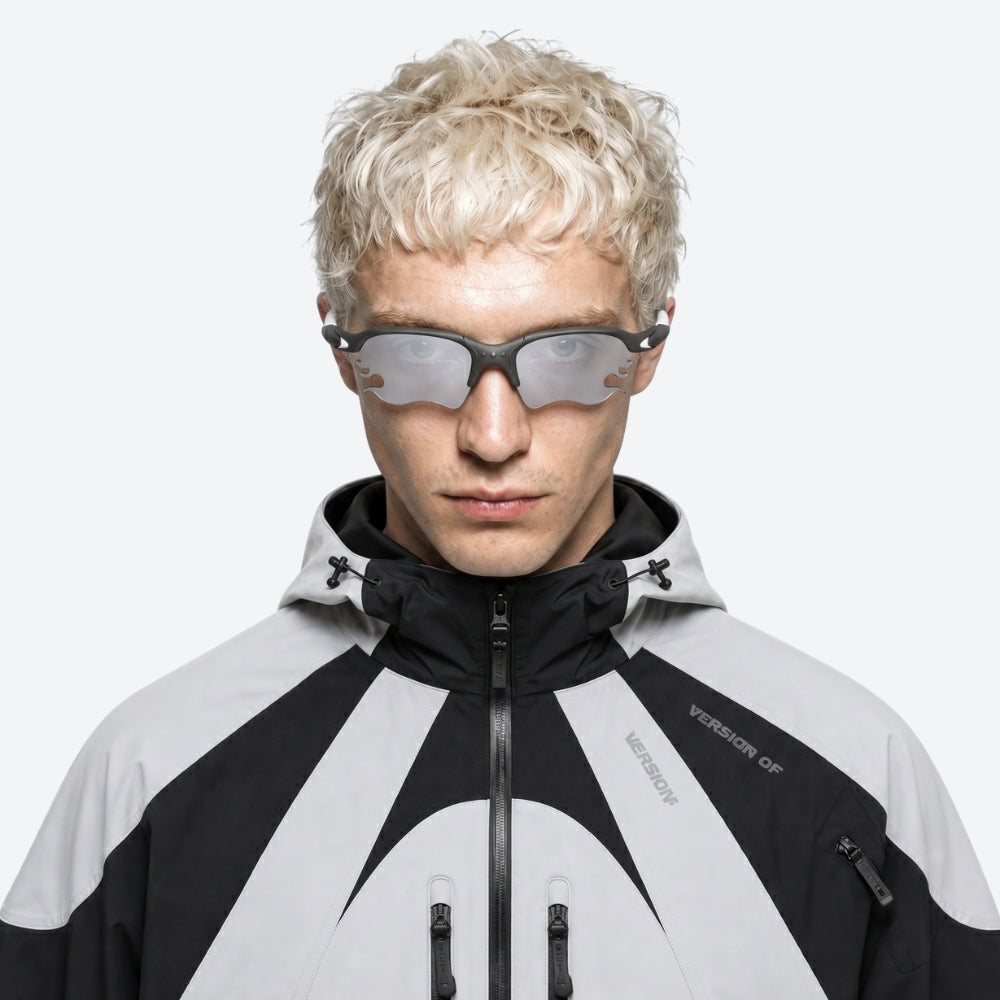Person wearing a black and VYSER White sunglasses with dark lenses on a white background