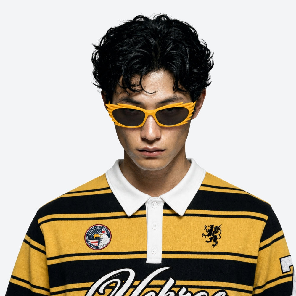 Person wearing a yellow and black striped polo shirt with VYSER Yellow sunglasses with a unique frame design on a white background