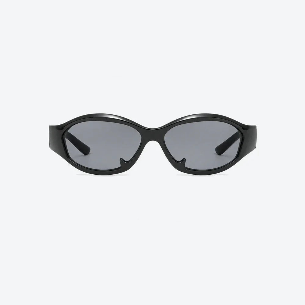 VYSER black cat-eye sunglasses with sleek frame and gray tinted lenses, minimalist streetwear style.