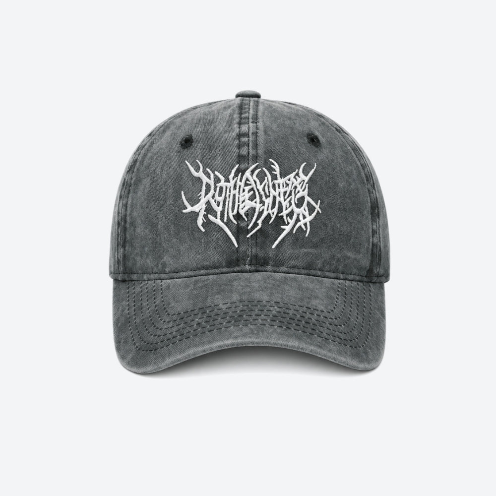 A washed grey baseball cap with a white gothic blackletter logo embroidered on the front, shown from the front